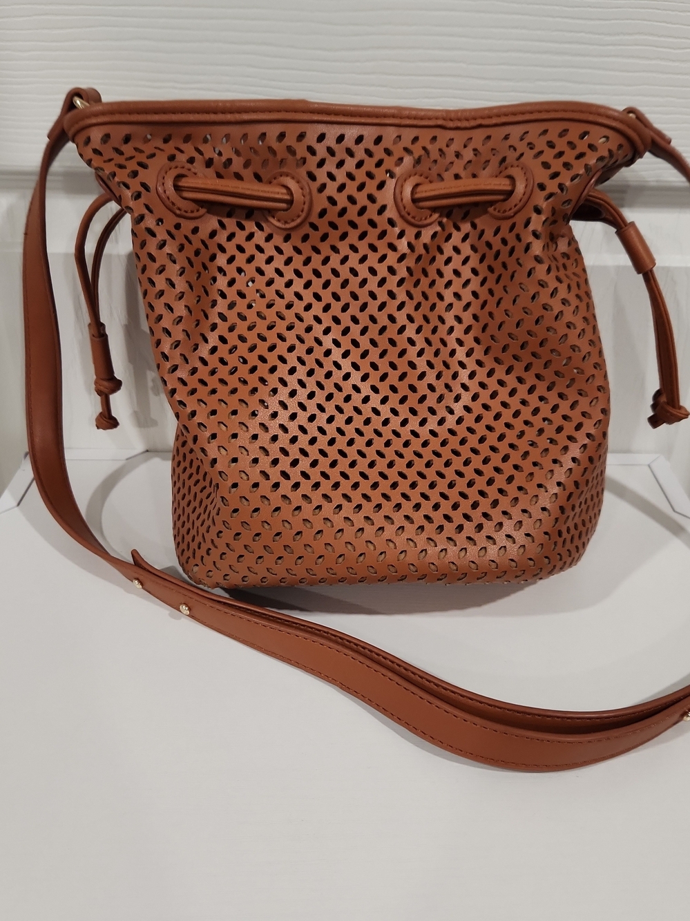Venus Brown Perforated Laser Cut Bucket Bag Crossbody Drawstring Purse Vegan PU
